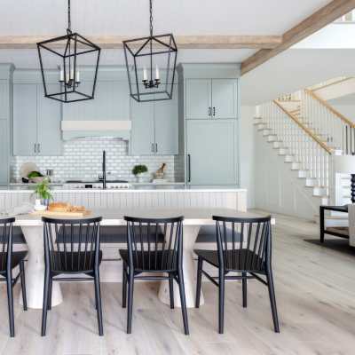 modern farmhouse kitchen with wooden beams and blue green cabinetry